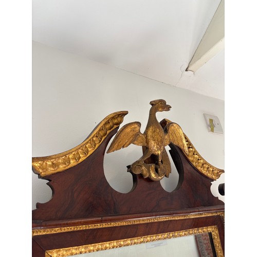  An early 19th century mahogany and gilt wall mirror surmounted by a HoHo bird - Height 118cm x Width... 