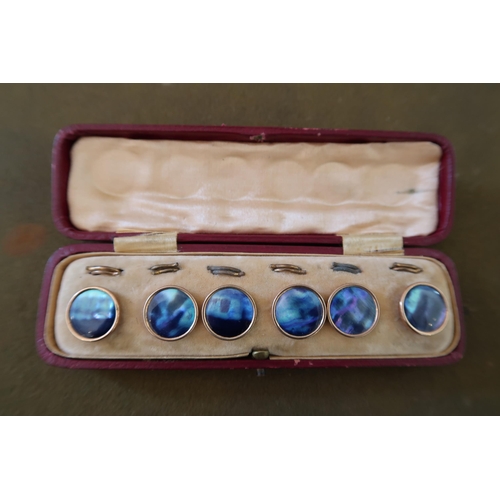 A set of six Edwardian dress studs. Believed to be abalone pearl with yellow metal fittings, In case... 