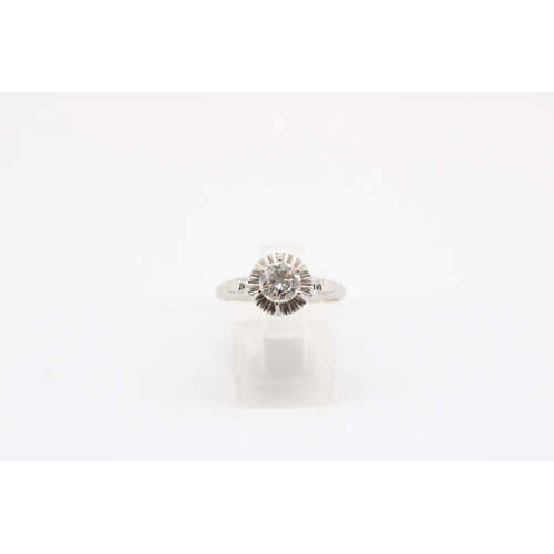 16 - A brilliant cut diamond illusion set ring. Estimated 0.60ct H/I SI1/SI2. Size P. Stamped 750. Weight... 