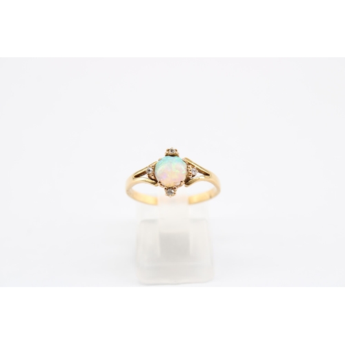 18 - A mid twentieth century opal and diamond dress ring. Size O 1/2. Stamped 18. Weight 2.30 grams. Smal... 