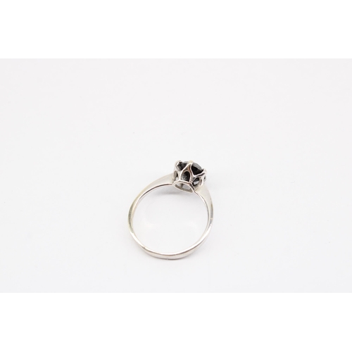 19 - A 9ct gold black diamond solitaire ring. Size P 1/2. Weight 2.34 grams