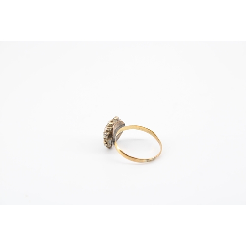 35 - A seed pearl and green gem finger ring. Band hallmarked 22ct. Head tests 9ct gold. Size G 1/2. Weigh... 
