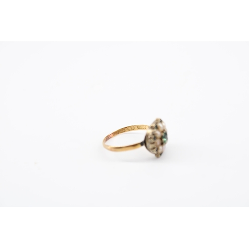 35 - A seed pearl and green gem finger ring. Band hallmarked 22ct. Head tests 9ct gold. Size G 1/2. Weigh... 