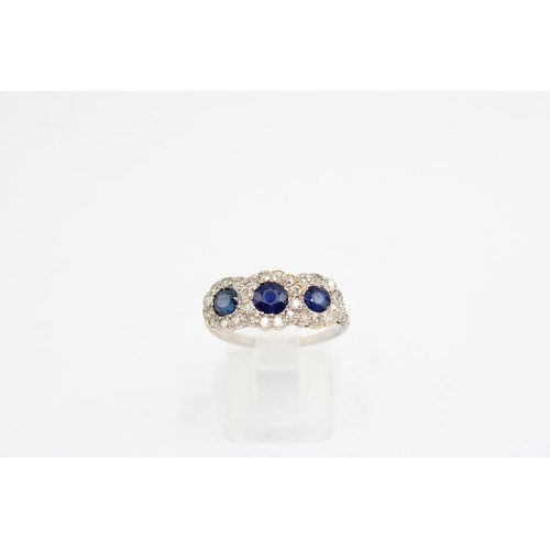 7 - A 1970's Sapphire & Diamond Triple Halo Cluster Ring featuring decorative gallery and carved sho... 