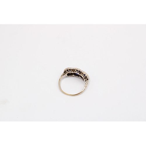 7 - A 1970's Sapphire & Diamond Triple Halo Cluster Ring featuring decorative gallery and carved sho... 