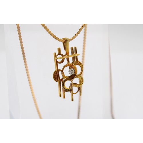 2 - An abstract line and circle pendant set with a brilliant cut diamond. Length 35mm. Stamped 18KT. Wei... 