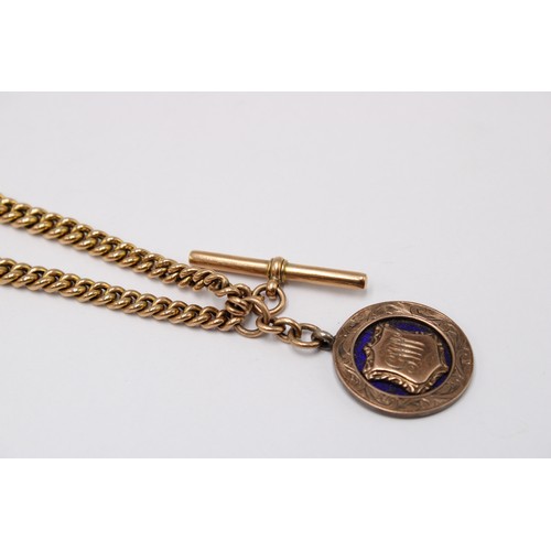 4 - A double Albert chain suspending t-bar, and two toggles, stamped 9ct. Also suspending a silver medal... 