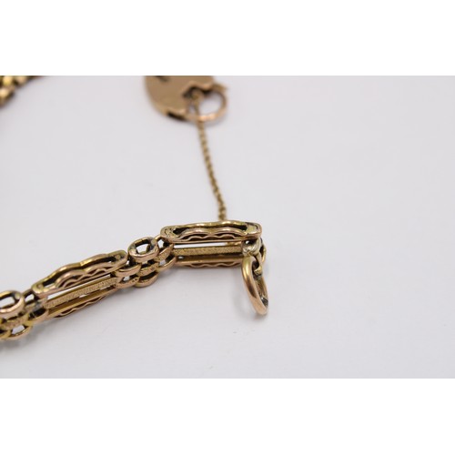 5 - A gate style bracelet. Surface Tests 9ct. Weight 13.80 grams
