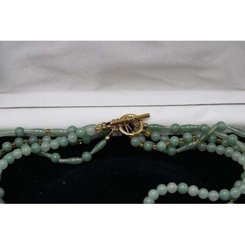 50 - A Vintage 4 Strand Jade Necklace with a Yellow Metal Clasp, approx. 52cms Long