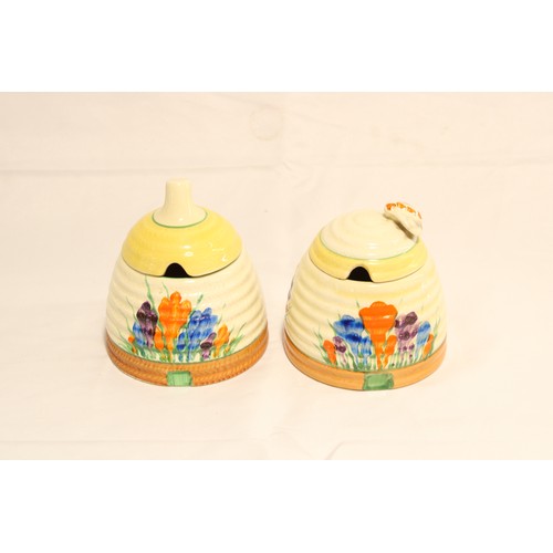 A Pair of Circa 1930/40's Clarice Cliff Crocus Pattern Beehive Honey Pots central ribbed body, hand-painted with sprays of crocus flowers. 10cm x 9.5cm 