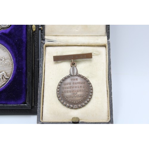 421 - A Pair of Unique Medal to include a Bronze Tiffany & Co Life Saving Benevolent Association of Ne... 