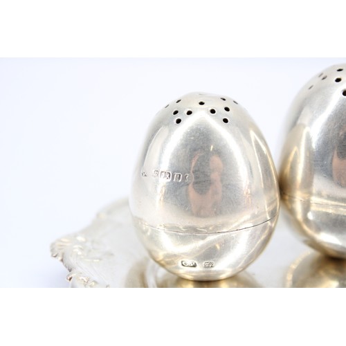 296 - Sterling Silver Dish with Decorative Border, 10cm diameter, together with two Salt and Pepper Shaker... 