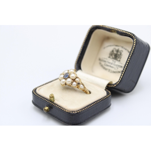 19 - A Victorian 18ct Tested Mourning Ring, Featuring a central cluster of pearls set with a sapphire.&nb... 
