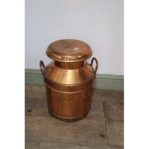 432 - A copper milk churn stamped Unigate Creameries Ltd - Height 52cm