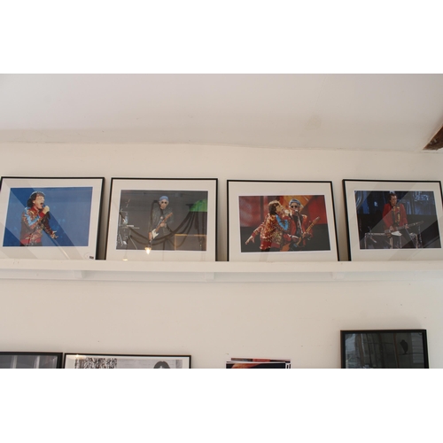 505 - A group of four framed photographs of The Rolling Stones in performance, including one of Keith Rich... 