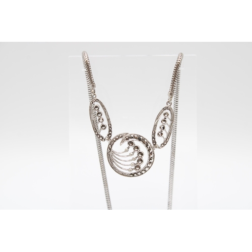 198 - An Art Deco Sterling Silver & Marcasite Necklace with circular motifs Length: 43cm