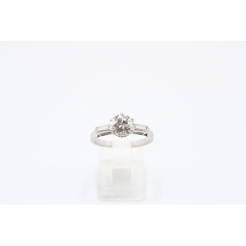 26 - An Unmarked Art Deco 18ct Tested Diamond Solitaire with Baguette Diamond Set Shoulders. Approximatel... 