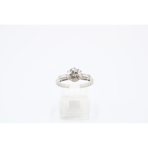 26 - An Unmarked Art Deco 18ct Tested Diamond Solitaire with Baguette Diamond Set Shoulders. Approximatel... 