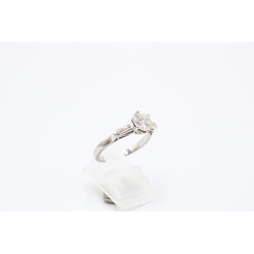 26 - An Unmarked Art Deco 18ct Tested Diamond Solitaire with Baguette Diamond Set Shoulders. Approximatel... 