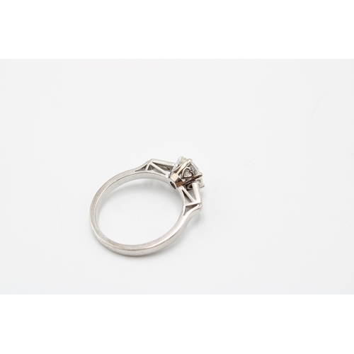 26 - An Unmarked Art Deco 18ct Tested Diamond Solitaire with Baguette Diamond Set Shoulders. Approximatel... 