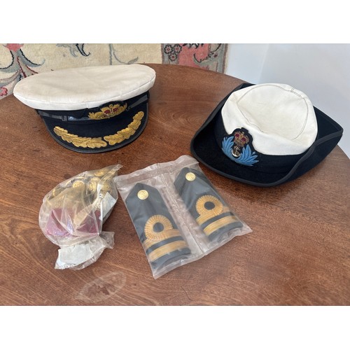379 - A Royal Navy uniform of a Commander, comprising wool jacket, waistcoat, trousers and two caps