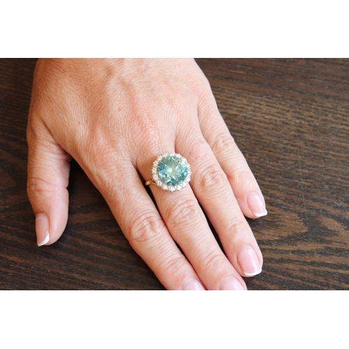 34 - A Good Quality 13.5mm Circular Blue zircon and brilliant cut diamond cluster ring. Size P. Weight 8.... 