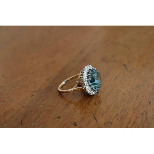 34 - A Good Quality 13.5mm Circular Blue zircon and brilliant cut diamond cluster ring. Size P. Weight 8.... 