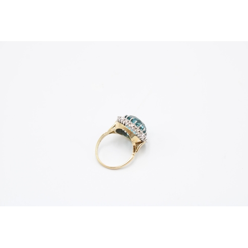 34 - A Good Quality 13.5mm Circular Blue zircon and brilliant cut diamond cluster ring. Size P. Weight 8.... 