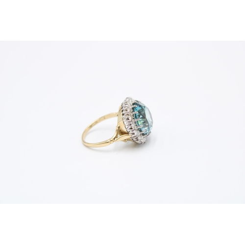 34 - A Good Quality 13.5mm Circular Blue zircon and brilliant cut diamond cluster ring. Size P. Weight 8.... 