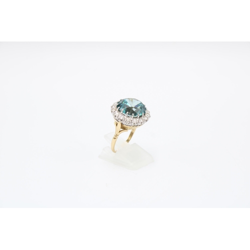 34 - A Good Quality 13.5mm Circular Blue zircon and brilliant cut diamond cluster ring. Size P. Weight 8.... 