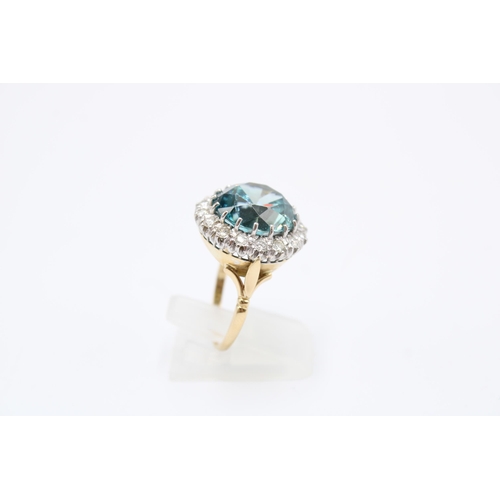 34 - A Good Quality 13.5mm Circular Blue zircon and brilliant cut diamond cluster ring. Size P. Weight 8.... 