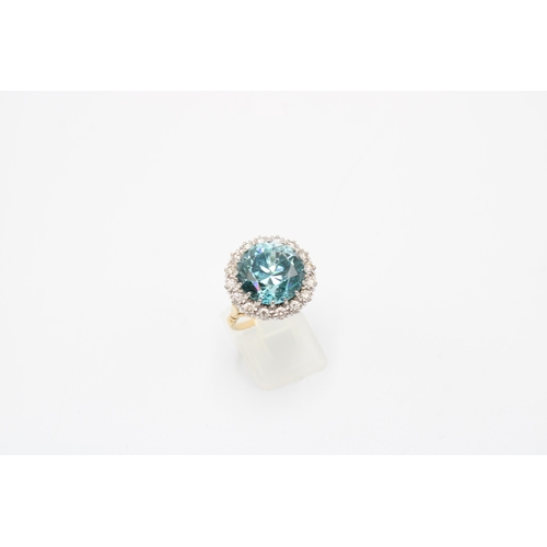 34 - A Good Quality 13.5mm Circular Blue zircon and brilliant cut diamond cluster ring. Size P. Weight 8.... 