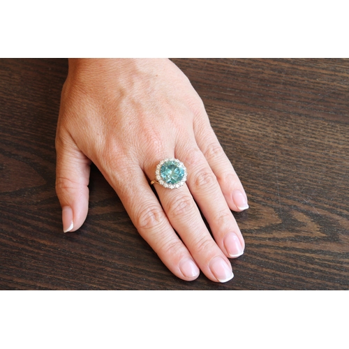 34 - A Good Quality 13.5mm Circular Blue zircon and brilliant cut diamond cluster ring. Size P. Weight 8.... 