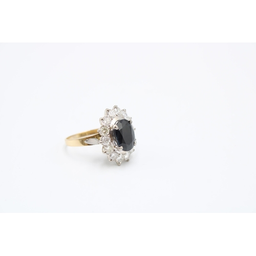 39 - An oval sapphire and diamond cluster ring. Total estimated diamond weight 1.75cts, Sapphire Approxim... 