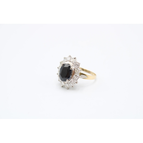 39 - An oval sapphire and diamond cluster ring. Total estimated diamond weight 1.75cts, Sapphire Approxim... 
