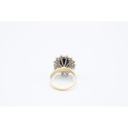 39 - An oval sapphire and diamond cluster ring. Total estimated diamond weight 1.75cts, Sapphire Approxim... 