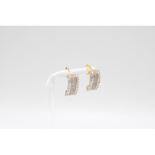 40 - A pair of 9ct gold diamond ear cuffs. Each designed as five brilliant cut diamond lines. Estimated t... 