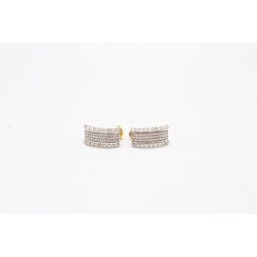 40 - A pair of 9ct gold diamond ear cuffs. Each designed as five brilliant cut diamond lines. Estimated t... 