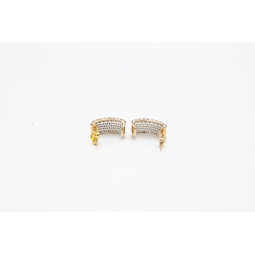 40 - A pair of 9ct gold diamond ear cuffs. Each designed as five brilliant cut diamond lines. Estimated t... 