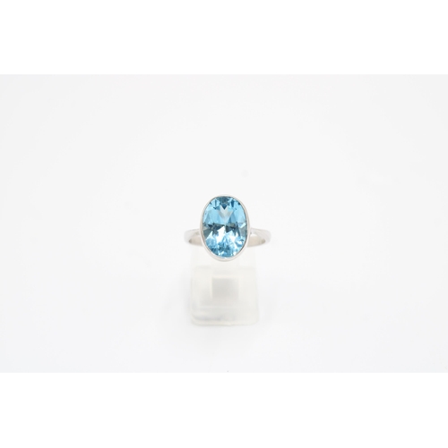 41 - A 9ct gold oval topaz single stone ring. Size O 1/2. Weight 4.76 grams