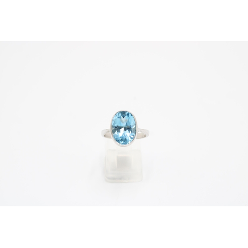 41 - A 9ct gold oval topaz single stone ring. Size O 1/2. Weight 4.76 grams