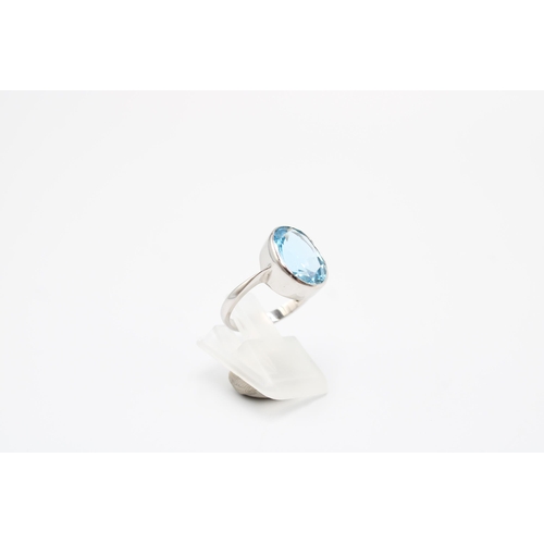 41 - A 9ct gold oval topaz single stone ring. Size O 1/2. Weight 4.76 grams
