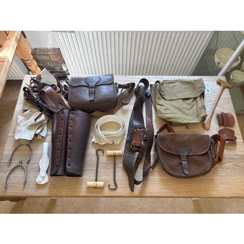378 - A group of cavalry fittings, First World War era, including a canvas gas mask bag, a pair of leather... 