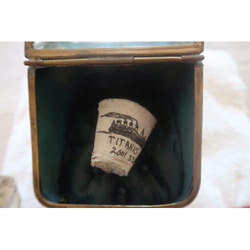 440 - Two Titanic related objects, the first a polystyrene foam cup shrunk by water pressure during a 2001... 