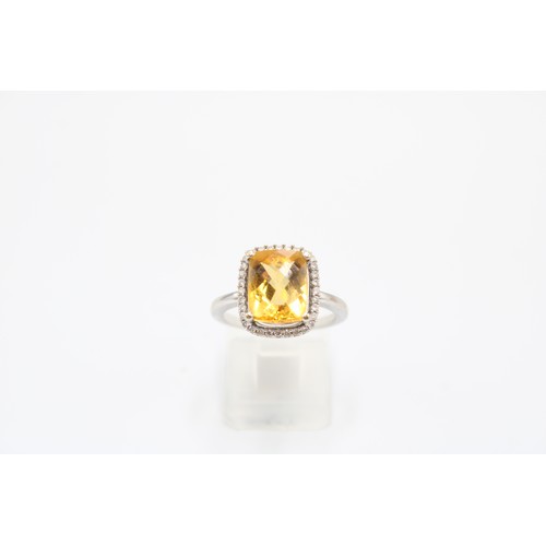  An 18ct Radiant Cut Citrine Halo Cluster Ring, Set with .20ct Diamonds, Citrine Approximately 2.5ct.... 