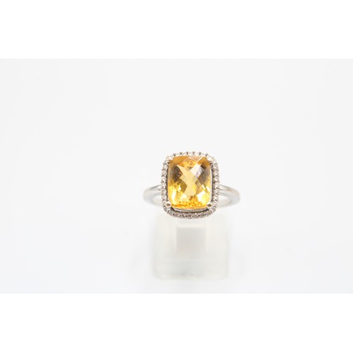  An 18ct Radiant Cut Citrine Halo Cluster Ring, Set with .20ct Diamonds, Citrine Approximately 2.5ct.... 