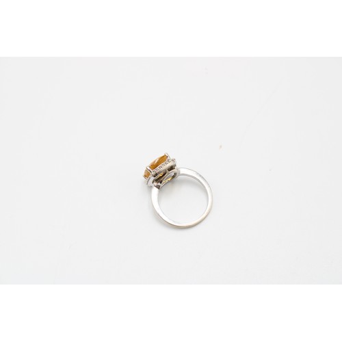  An 18ct Radiant Cut Citrine Halo Cluster Ring, Set with .20ct Diamonds, Citrine Approximately 2.5ct.... 