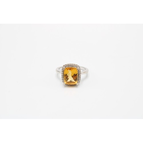  An 18ct Radiant Cut Citrine Halo Cluster Ring, Set with .20ct Diamonds, Citrine Approximately 2.5ct.... 
