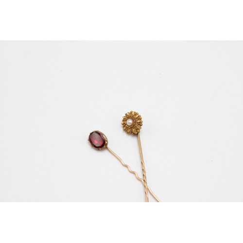  A Pair of Gold Stick Pins. Body of pins testing 9ct, Head of Red Stone Pin also testing 9ct, Peal Se... 