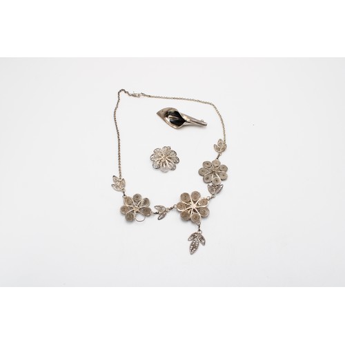 A group of silver jewellery, including a brooch, Mexico City, in the form of a calla lily, stamped 9... 